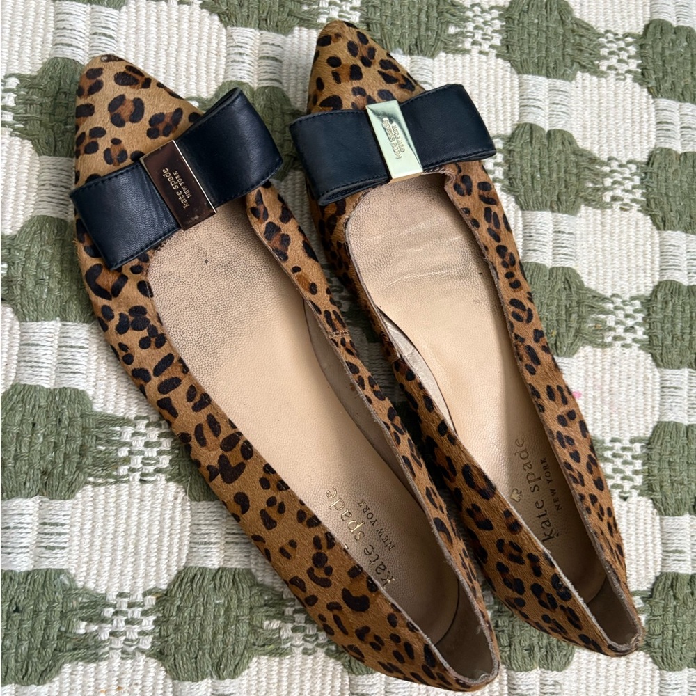 Kate spade leopard pointed toe flats with bows and gold details in pony fur